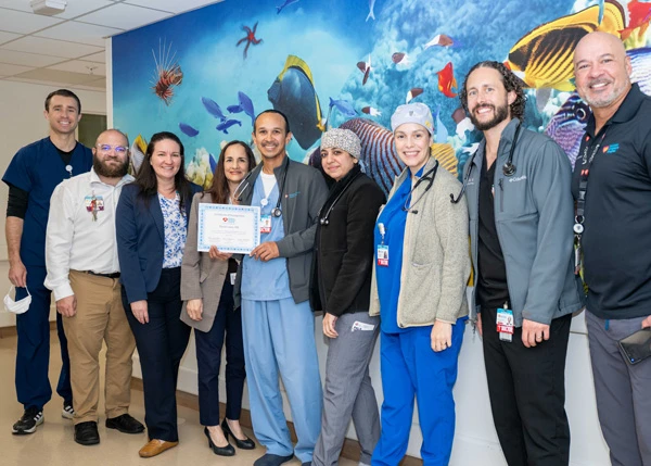 Dr. Lowe and his ER team receiving the FAC award.