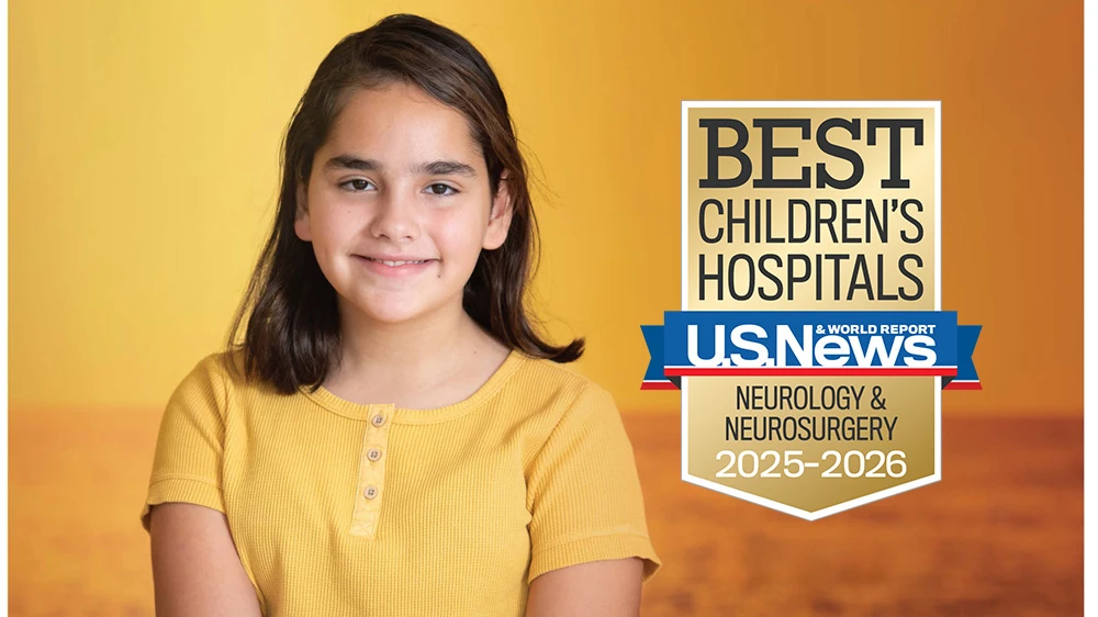 Patient Nicole smiling in front of a sunset.