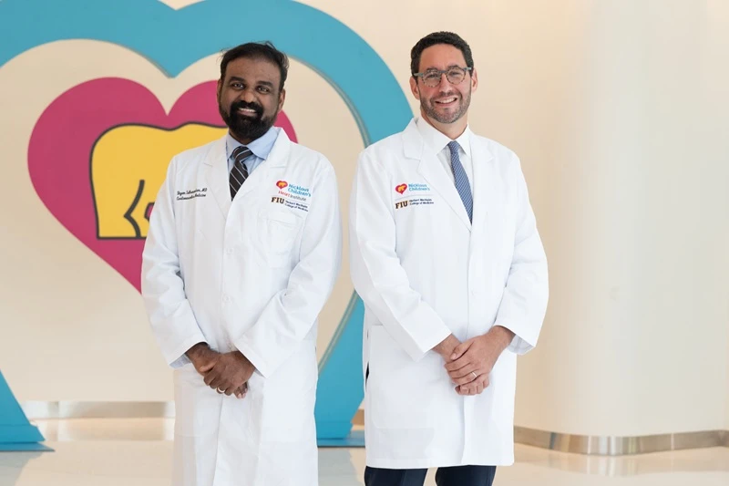 two doctors smiling.