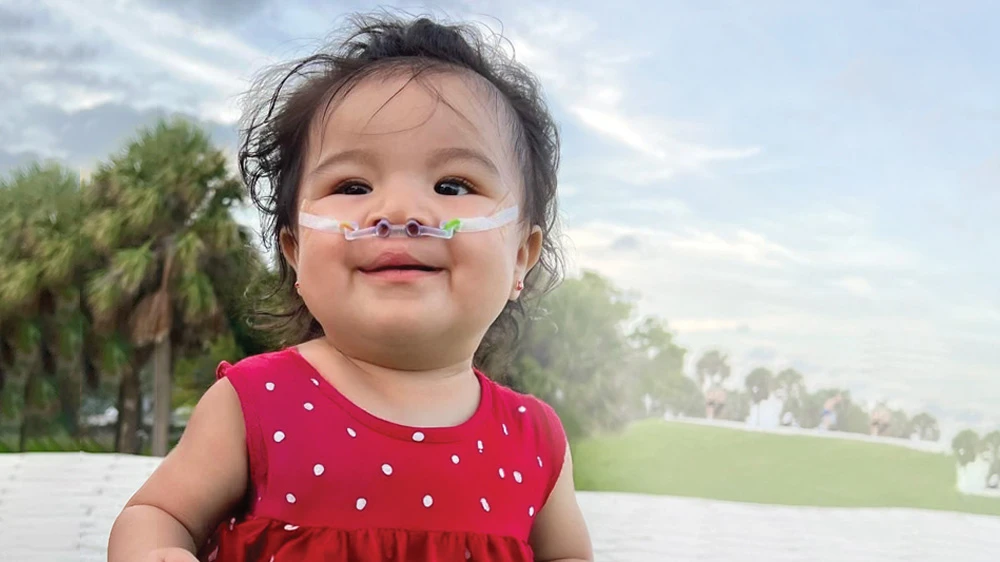 patient Keily smiling happily.