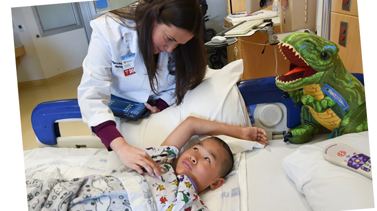 dr. monduy checks on tamryn after implant.