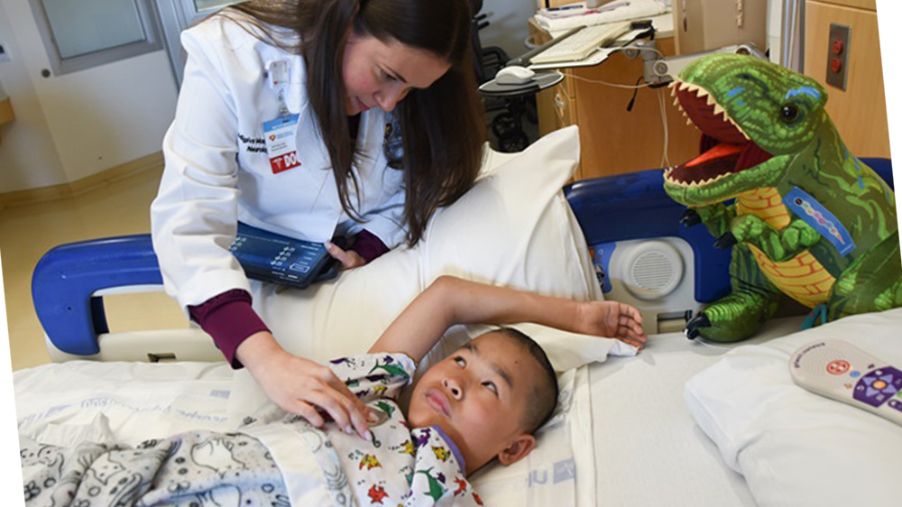 dr. monduy checks on tamryn after implant.
