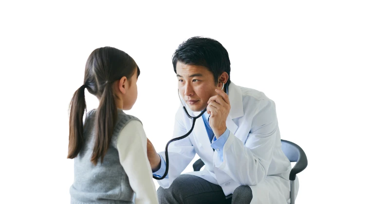 physician listen to girl's chest with stethoscope.