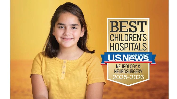 Patient Nicole smiling in front of a sunset.