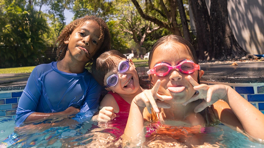 children playing in a pool.
