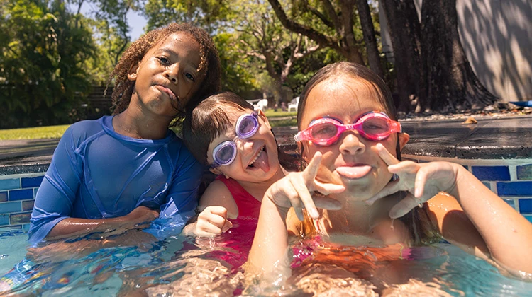 children playing in a pool.